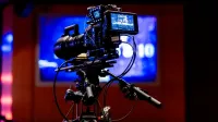 High-tech video camera setup in modern studio environment, showcasing professional equipment for filming.