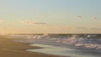 Playa de Cape Cod al atardecer, playa de punto de carrera