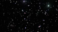 A captivating view of numerous galaxies scattered across the universe, showcasing the vastness of space.