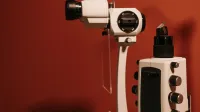 High-quality slit lamp microscope used in ophthalmology for eye examinations, captured indoors.