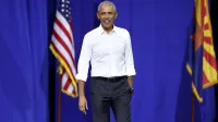 Former President of the United States Barack Obama speaking with supporters at a campaign rally for Vice President Kamala Harris at the Cole and Jeannie Davis Sports Center in Tucson