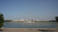 View from the Kim Il-Sung Square over Taedong River towards the Juche Tower, Pyongyang.