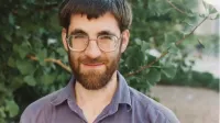 Richard Borcherds at Berkeley, California in 1993 (accidentally left a hairpiece while scanning, seen at right).