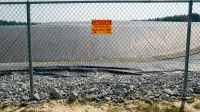 A radiation warning sign on the fence outside the restricted area at the Maxey Flat Low Level Radioactive Waste site in Maxey Flat, Kentucky, USA.