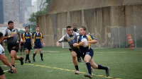 A Misfits rugby player closes in for a tackle during one of Camp Lejeune's three games at the Liberty Cup Rugby Tournament, held Aug.
