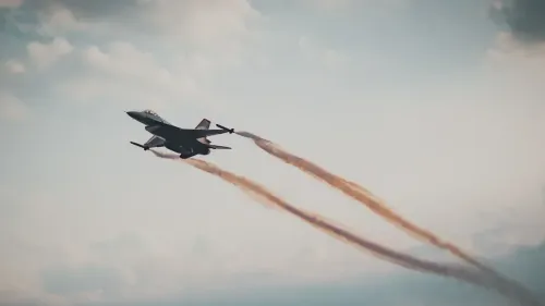 Dynamic capture of a military fighter jet soaring through a cloudy sky.