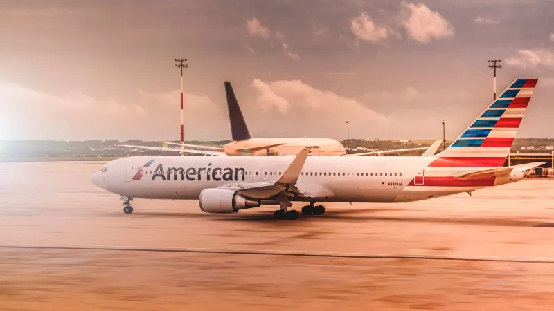 American Airlines aircraft on the runway at Paris Charles de Gaulle Airport during daylight.
