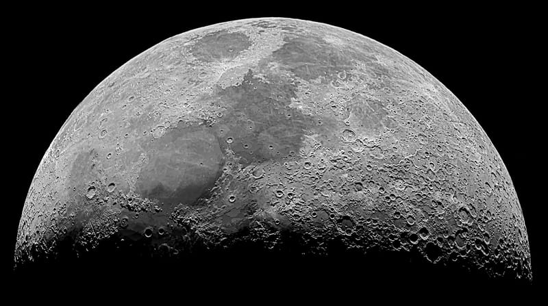 High-resolution monochrome image of the moon's surface showcasing craters and details.