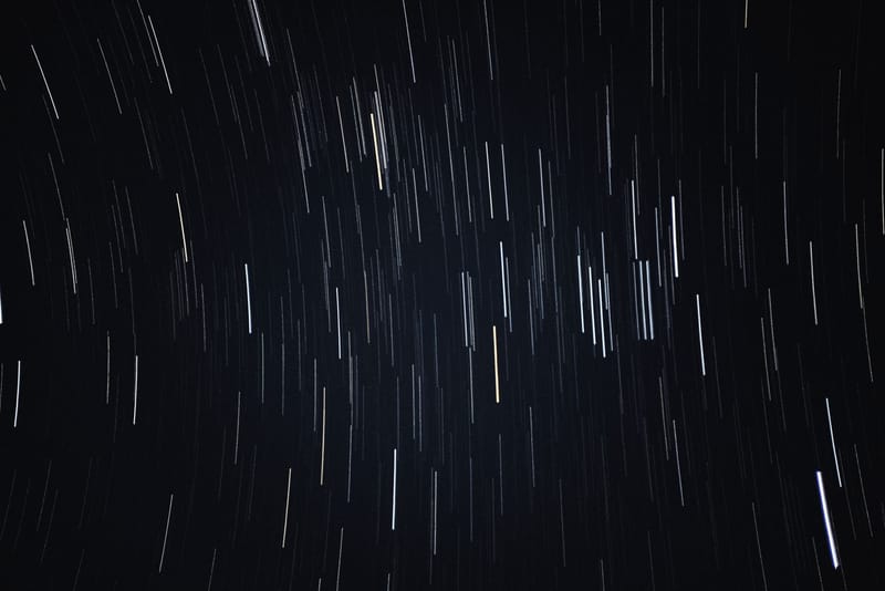 Captivating long-exposure shot of star trails, capturing the night sky's motion from Kollam, India.
