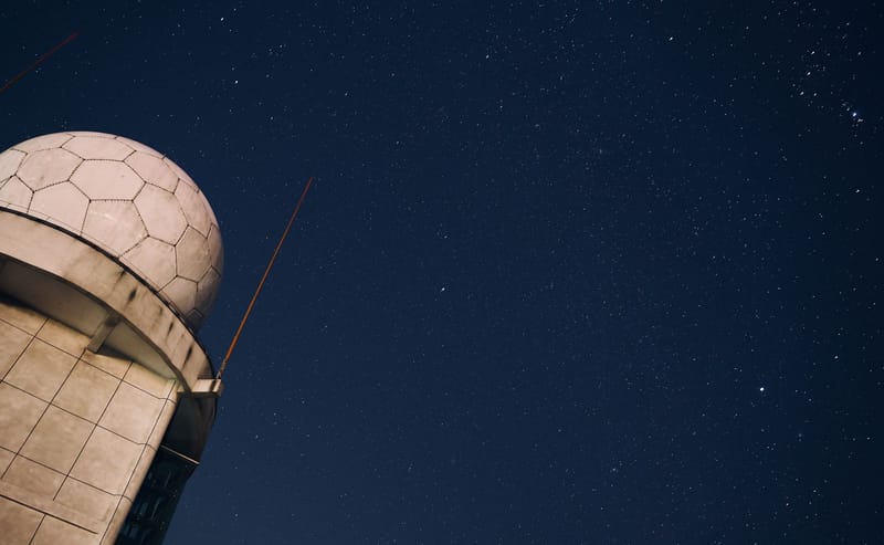A stunning view of a starry night sky above an observatory dome, capturing the beauty of the cosmos.
