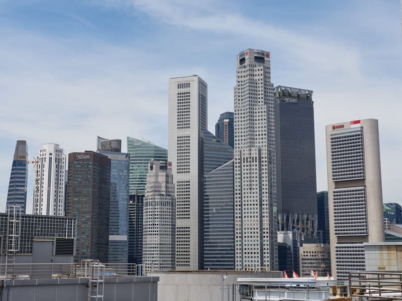 Stunning view of Singapore's modern skyline featuring iconic skyscrapers under a clear sky.