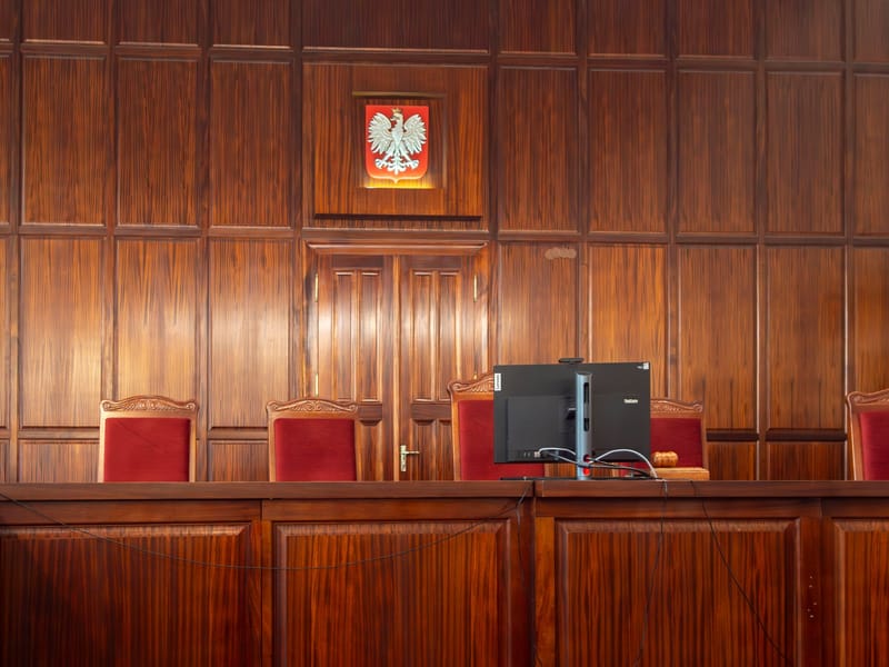 A beautifully crafted wooden courtroom with the Polish emblem in Wrocław, Poland.