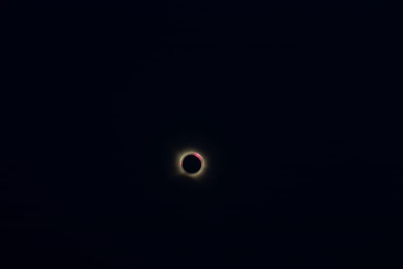 Captivating view of a total solar eclipse with a glowing corona set against a deep dark sky.