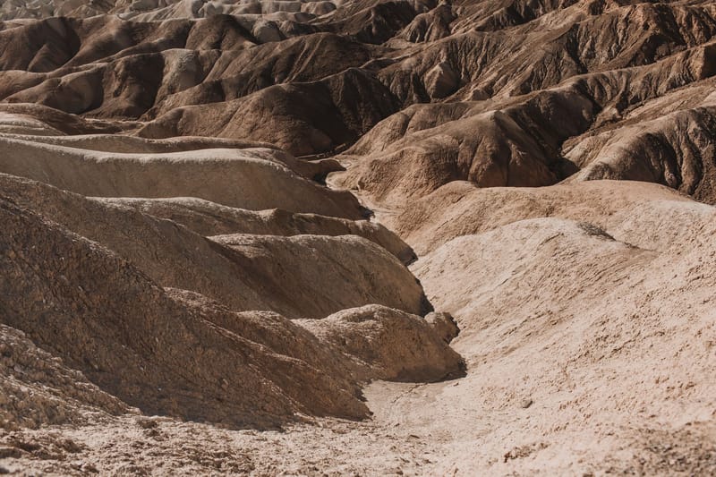 A captivating view of rugged, dry terrain in Death Valley's desert landscape.