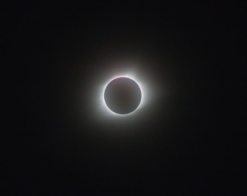 A breathtaking view of a full solar eclipse, showcasing the sun's corona.