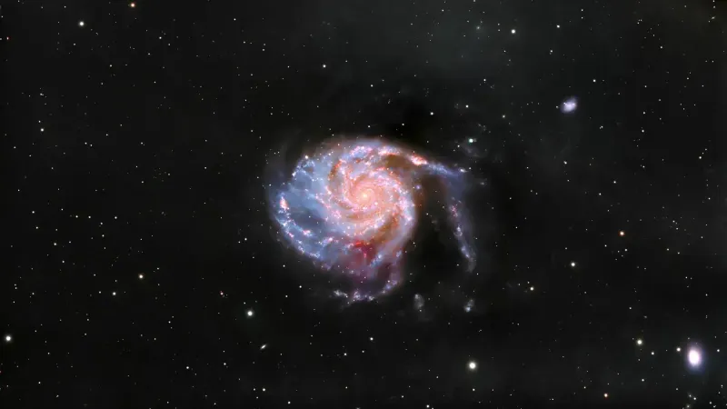 Captivating view of a spiral galaxy amidst stars in the vast universe.