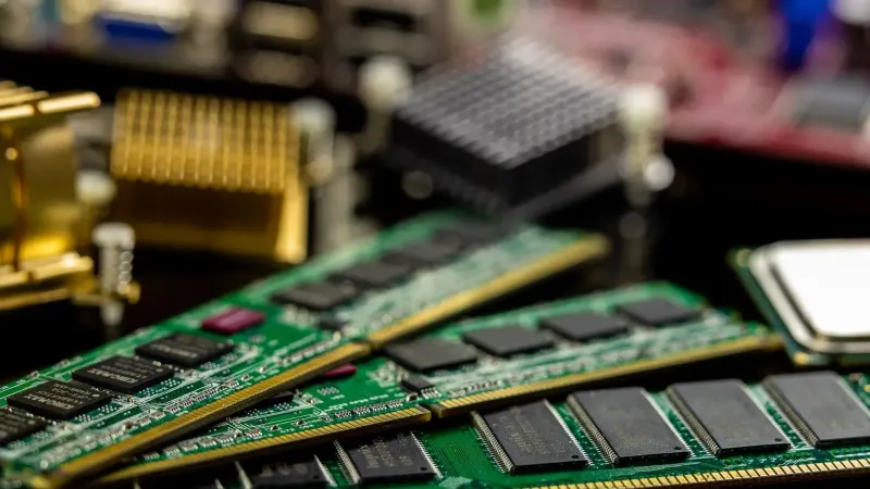 Detailed view of RAM sticks and microprocessors on a motherboard.