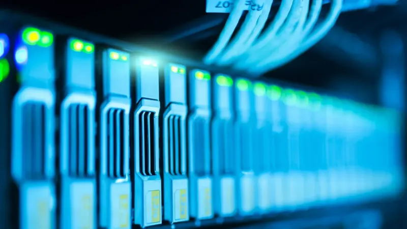 Detailed image of a server rack with glowing lights in a modern data center.
