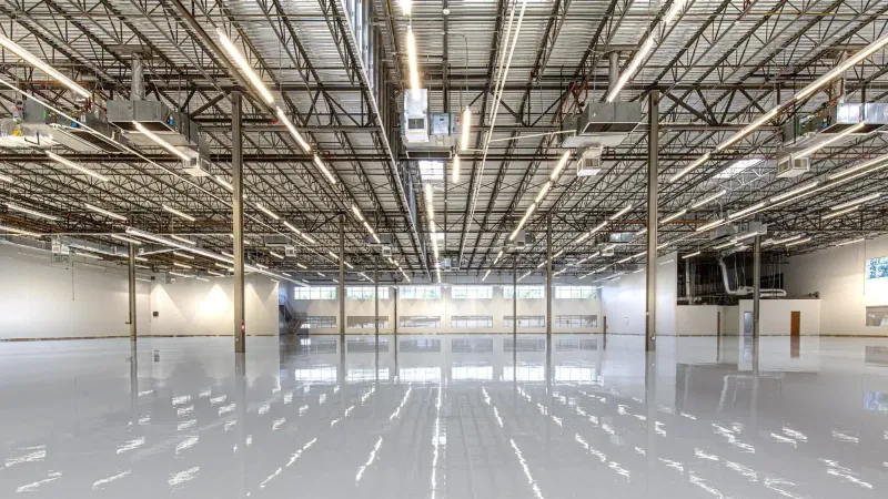 Spacious and polished industrial facility with glossy epoxy flooring in Houston, Texas.