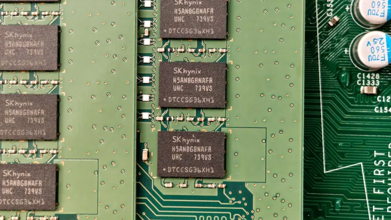 Detailed view of a green circuit board with SK hynix chips, showcasing electronic components.