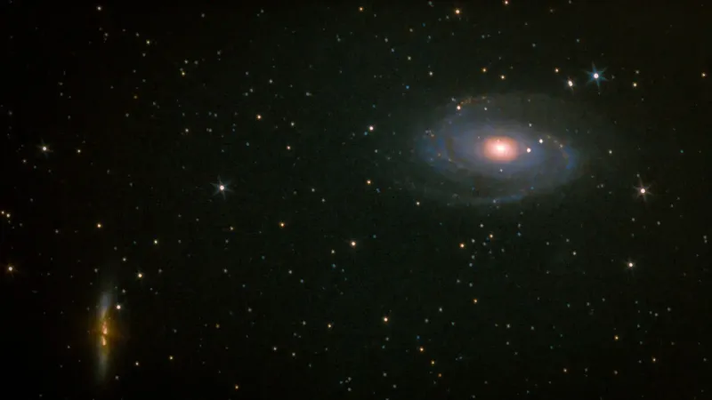 A captivating view of a spiral galaxy surrounded by thousands of stars in the night sky.