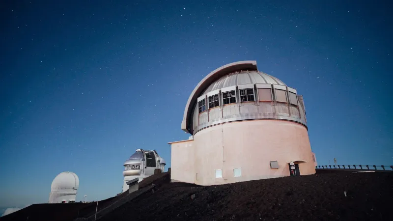 A stunning observatory under a clear, starry night sky, perfect for astronomy enthusiasts.