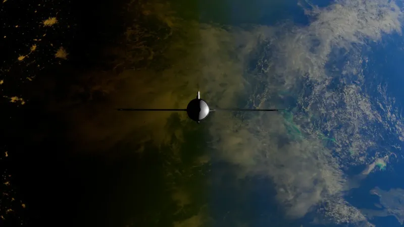 A satellite orbiting Earth showcasing contrasts between ocean and land from space.