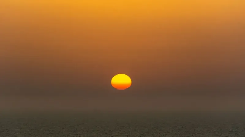 Captivating sunset with vibrant colors illuminating the ocean horizon.