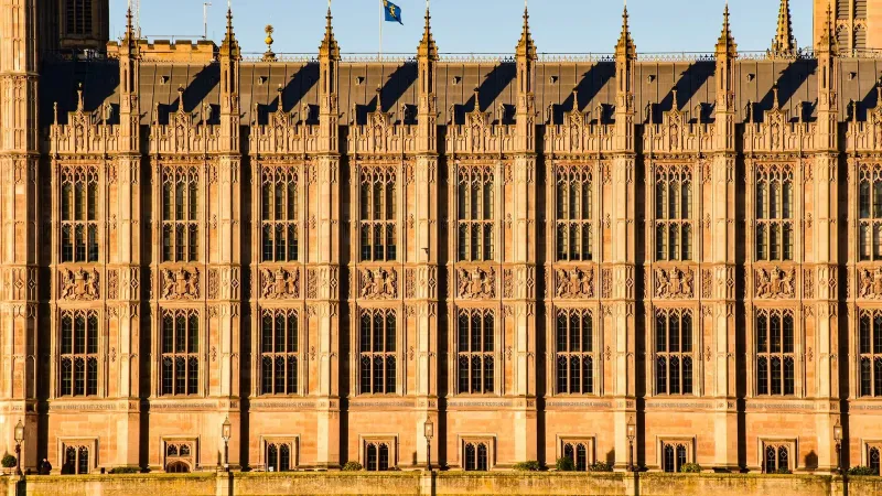 Close-up view of Westminster Palace's intricate Gothic architecture in London, UK.