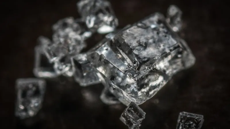 Macro shot of clear crystal cubes showcasing intricate details and textures.