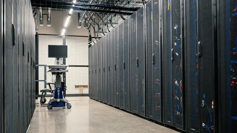 Steel framework cabinets housing servers networking devices and cables in contemporary equipped data center
