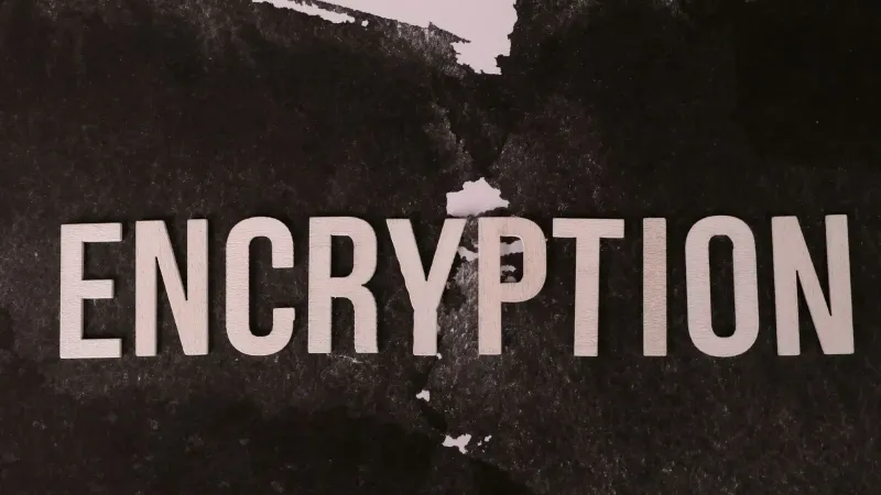 Black and white abstract image with the word 'ENCRYPTION' prominently displayed.