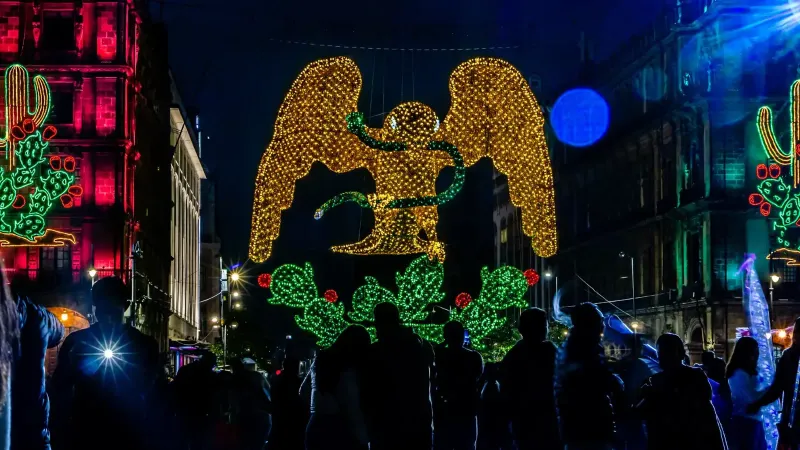 Vibrant night scene with illuminated angel in Mexico City.