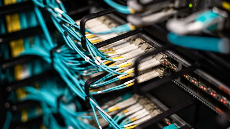 Numerous wires and cables mounted into server patch panel in modern data center