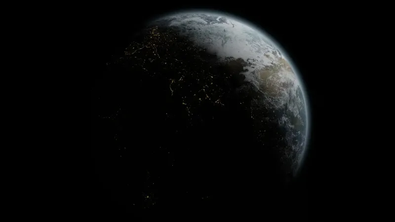 A breathtaking night view of Earth showing glowing city lights from space.