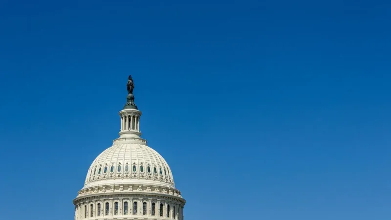 Stunning view of the US Capitol Dome in Washington, DC, with clear blue sky.