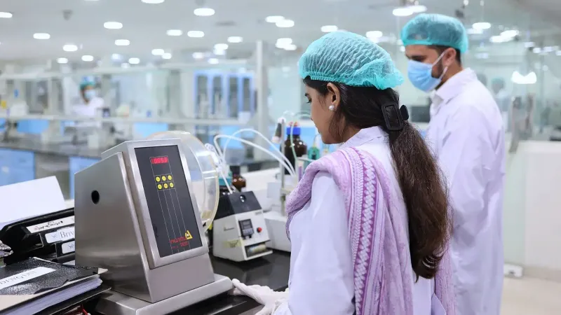 Scientists conducting tests in a pharmaceutical lab in Islamabad, Pakistan.