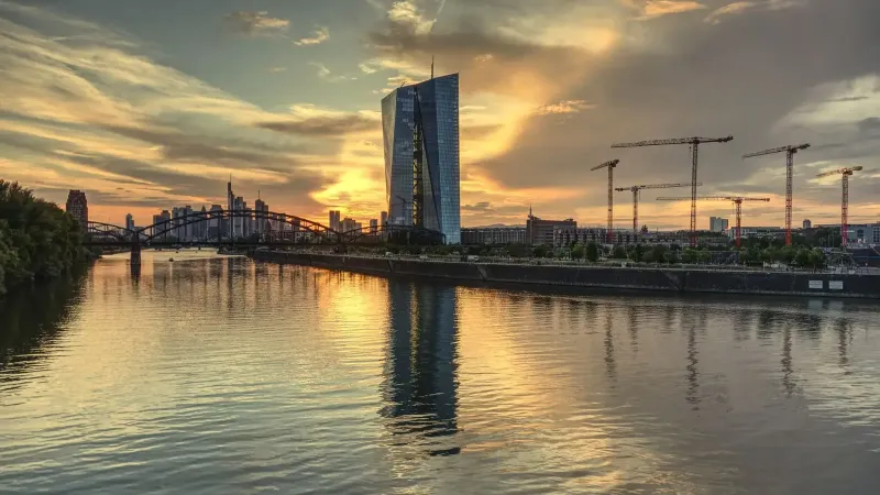 Stunning view of the Frankfurt skyline and ECB building during sunset reflecting on the Main River.