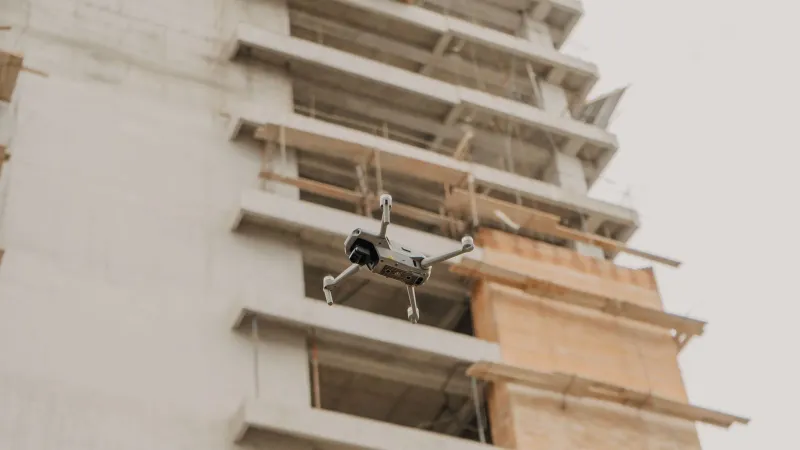 Aerial drone in flight near a construction site in urban Guatemala.
