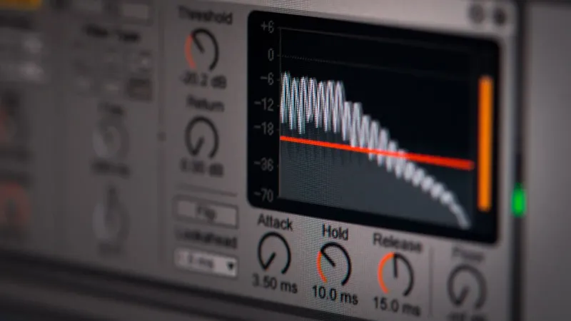 Close-up of audio editing software interface featuring waveform and controls.