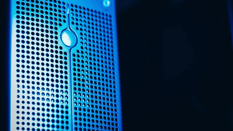 Modern server rack with blue lighting in a secure data center environment.