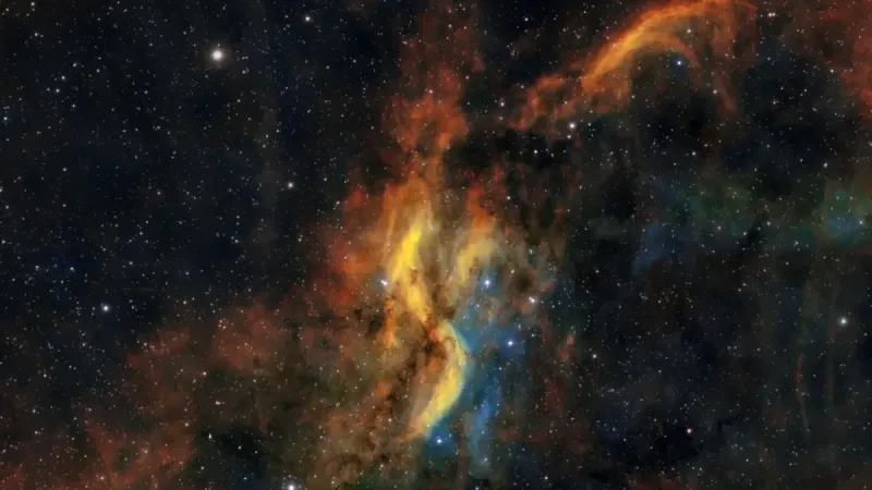 Dynamic scene of colorful gas clouds and stars in a cosmic nebula.