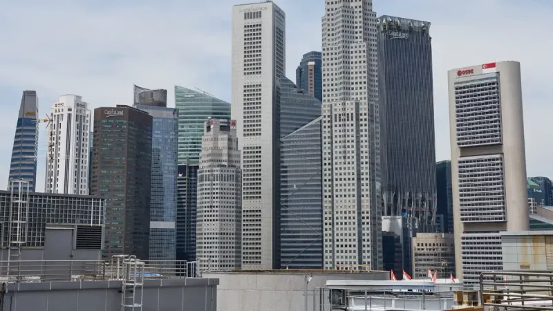 Stunning view of Singapore's modern skyline featuring iconic skyscrapers under a clear sky.