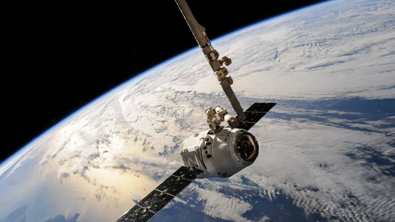 A satellite glides over Earth showcasing dramatic cloud formations and the vast expanse of space.