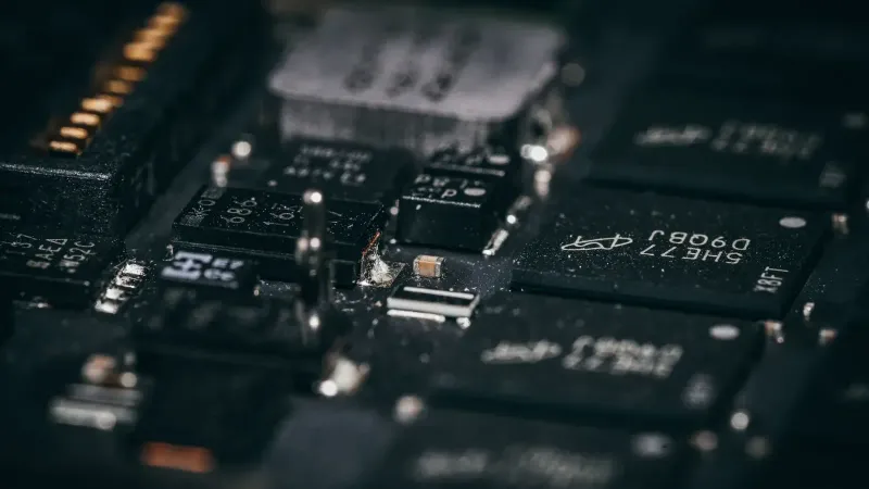 Detailed macro shot of electronic circuit components showcasing intricate design and layout.