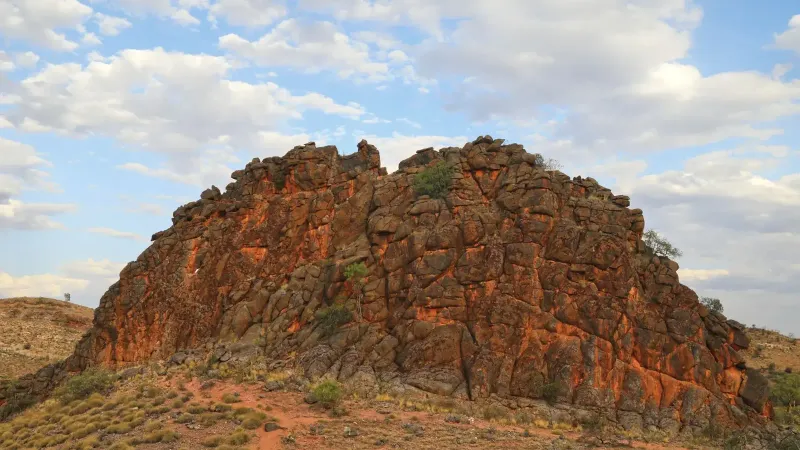 Explore the dramatic rock formations of Australia's Northern Territory under a vibrant sky.