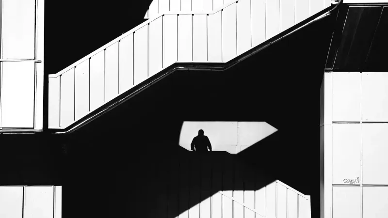 Black and white silhouette of a person on stairs in İstanbul, Türkiye capturing urban architecture.