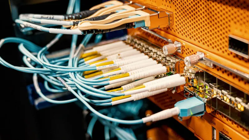 Modern hardware and structured cabling system with patch cords inserted into patch panel outlets