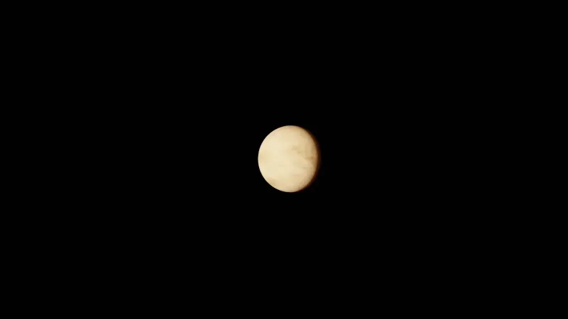 Image of planet Venus against a black space background, highlighting its atmospheric details.