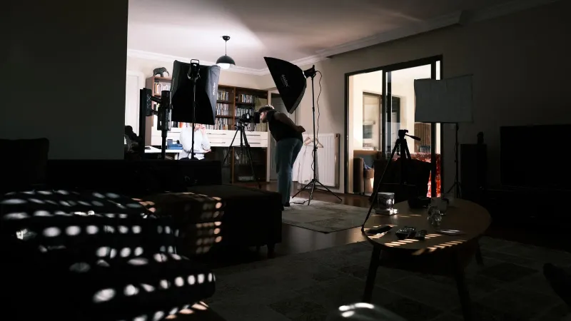 A cozy home studio with professional lighting equipment for a photo session.
